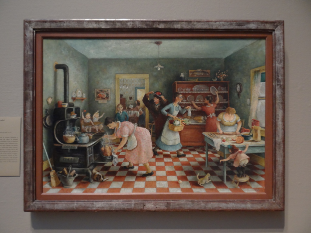 Ein Rahmenbild an einer Wand, das mehrere Frauen in einem Raum bei verschiedenen Aktivitäten zeigt.