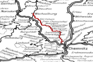 Schwarz-weiß-Stadtplan mit einer roten Bahnlinie, beschriftet als Wechselburg und Chemnitz-Bahnroute-Karte.