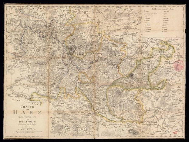 Eine detaillierte alte Karte der Stadt Harz, Deutschland, auf einem schwarzen Hintergrund, die Städte, Ortschaften und die umliegende Landschaft mit informativen Texten zeigt.