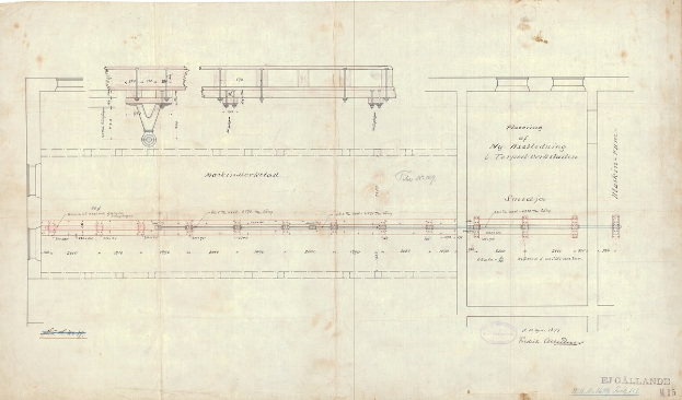 Detailzeichnung einer Eisenbahnschiene auf Papier mit Schienen, Lokomotiven und anderen Komponenten sowie begleitendem Text.